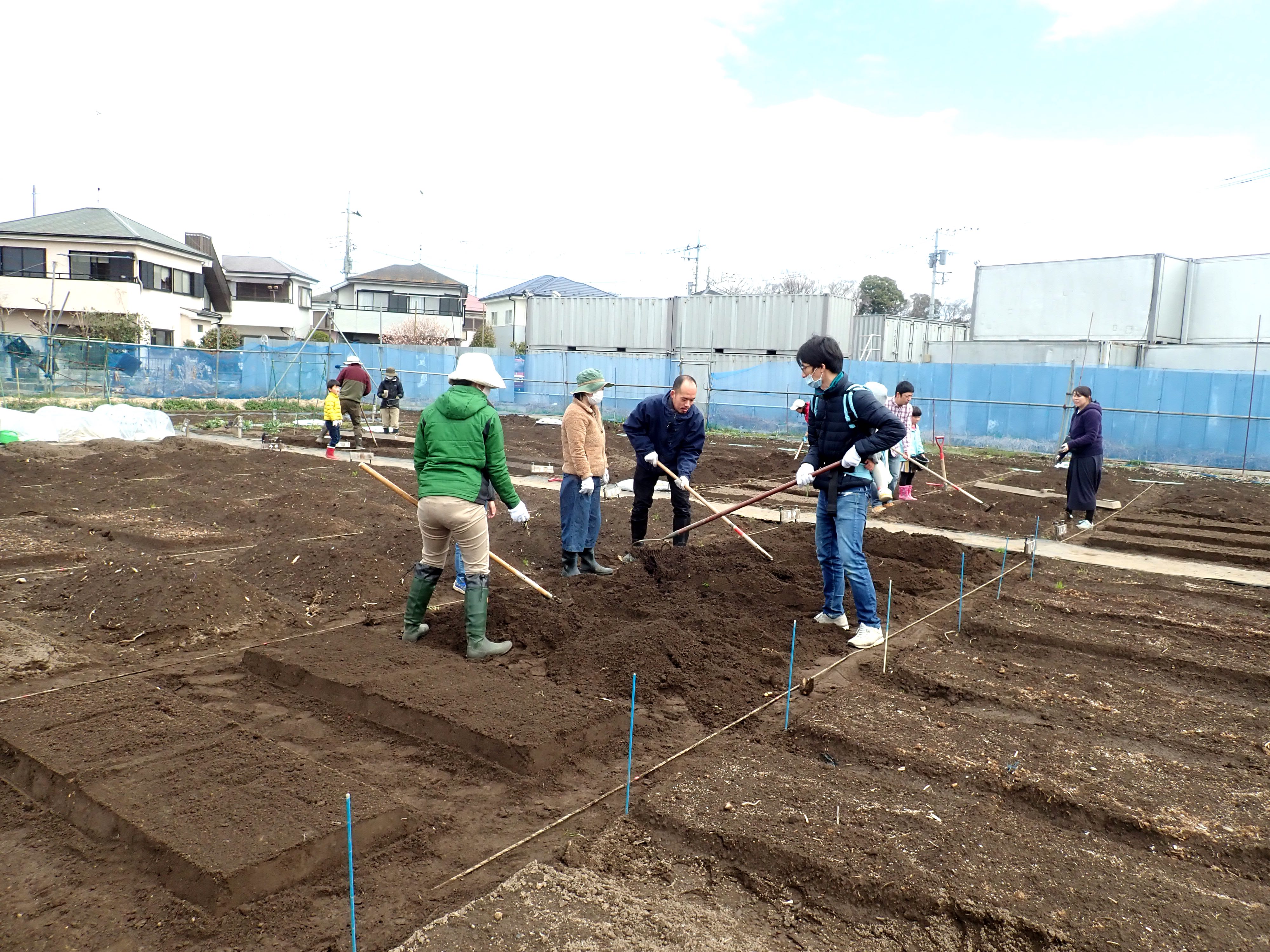 Gardeners helping in the community garden