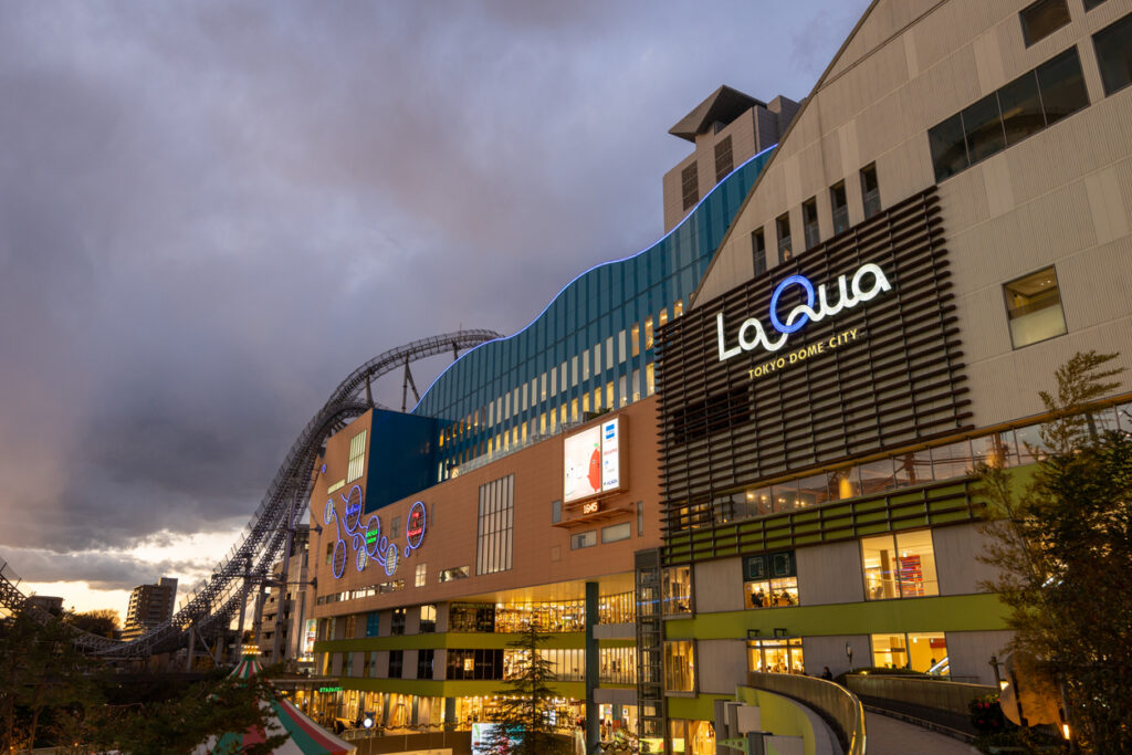 Tokyo, Japan - December 22, 2023 : General view of the Tokyo Dome City. It is an entertainment complex in Bunkyo Ward, Tokyo, Japan. It consist of Tokyo Dome, LaQua spa complex, amusement park and hotel.