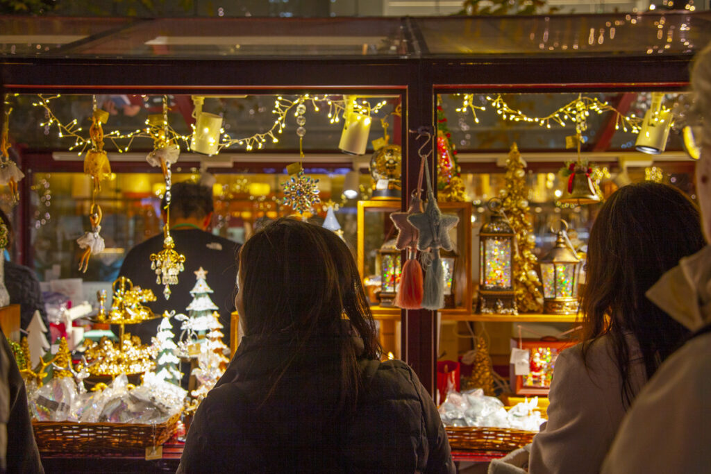 Tokyo, Japan - November 25, 2024.
People looking inside a store window in Tokyo, Japan.
