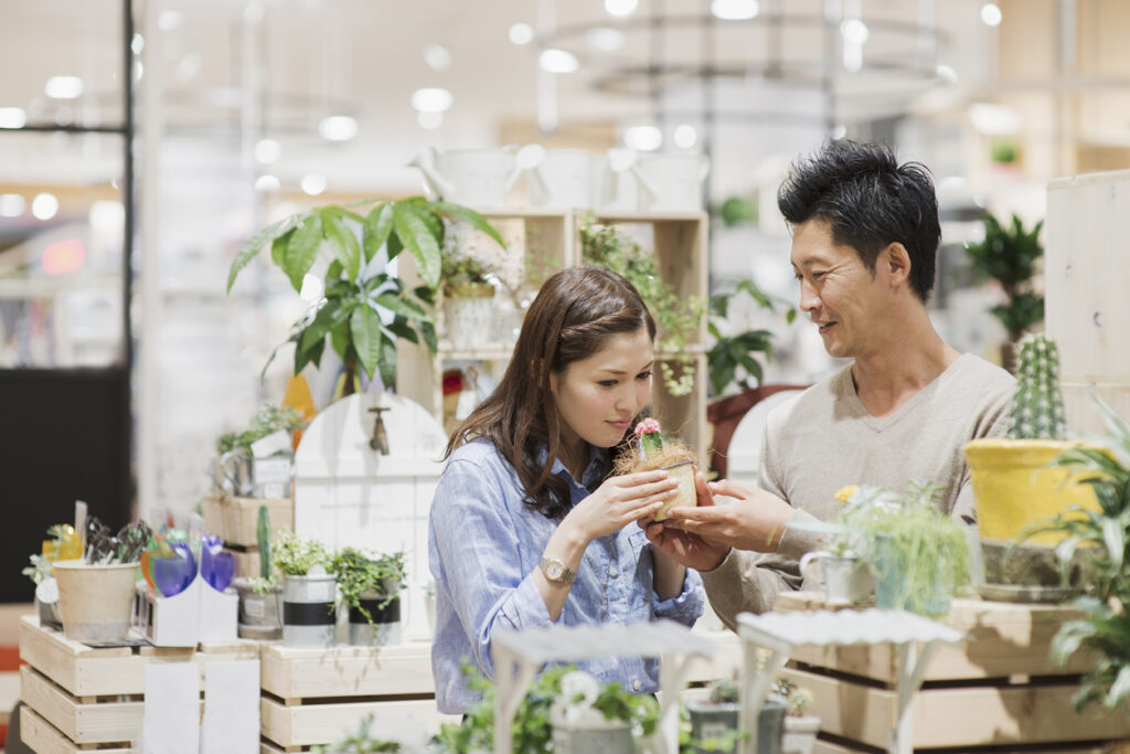 Mid Adult man and Young Woman having good time in the supermarket.