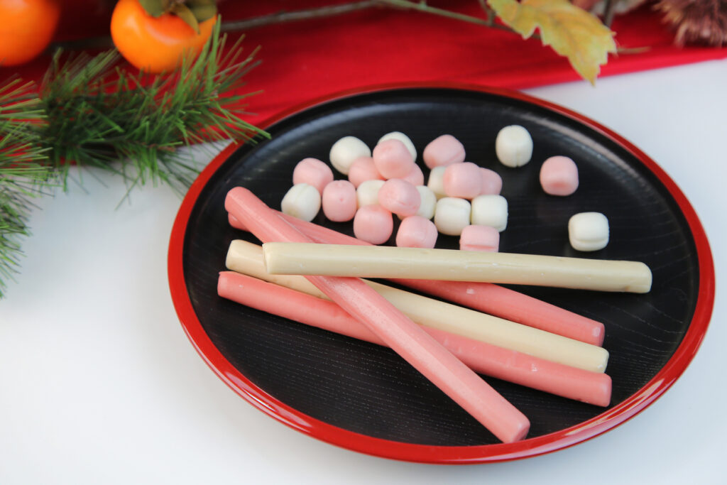 a long stick of red and white candy sold at children's festivals
